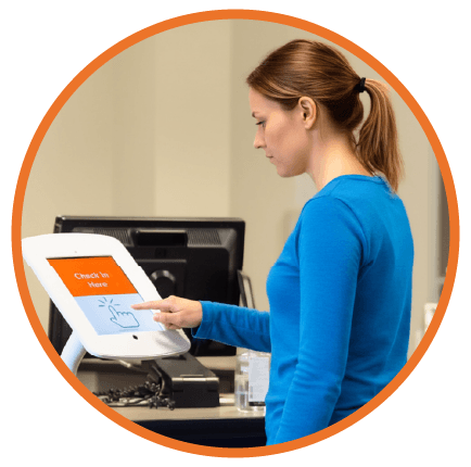 Woman at check-in kiosk