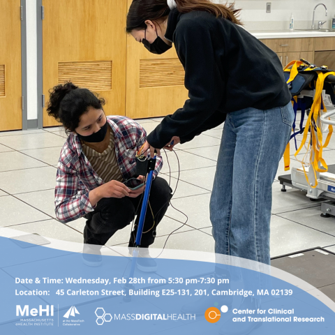 Two women testing out an assistive device for walking